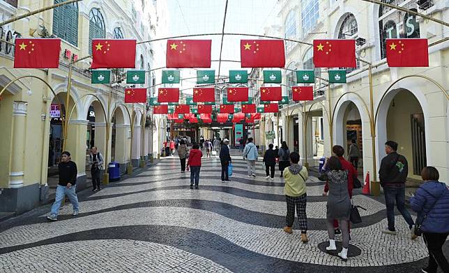 People visit a tourist attraction in Macao, south China, Dec. 17, 2024. The streets of Macao have been adorned by festive decorations, as the city is set to mark the 25th anniversary of its return to the motherland. (Xinhua/Yao Qilin)