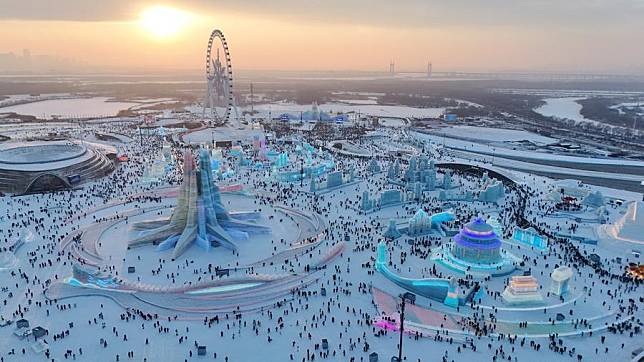 An aerial drone photo shows a view of the Harbin Ice-Snow World in Harbin, northeast China's Heilongjiang Province, Dec. 21, 2024. (Xinhua/Wang Song)