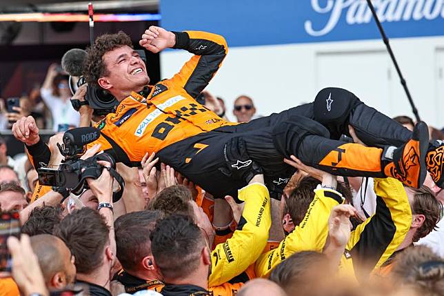 McLaren's British driver Lando Norris celebrates with his crew after winning the Miami Formula One Grand Prix at the Miami International Autodrome in Miami Gardens, Florida, the United States, May 5, 2024. (Photo by Qian Jun/Xinhua)