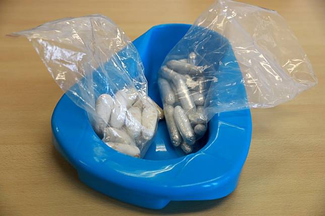 Sample drug pellets are displayed during an interview on internal concealment of drugs at the Customs Headquarters Building in North Point. Photo: May Tse