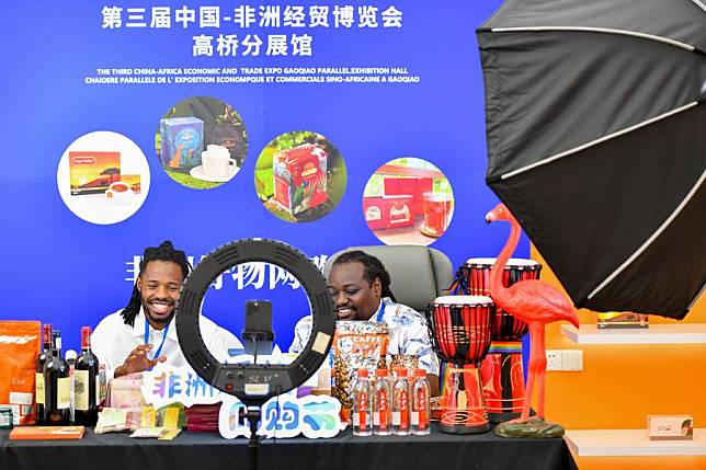 African exhibitors promote products via livestreaming at the China-Africa Economic and Trade Cooperation Promotion Innovation Demonstration Park (Gaoqiao Grand Market) in Changsha, central China's Hunan Province, June 30, 2023. (Xinhua/Chen Zeguo)