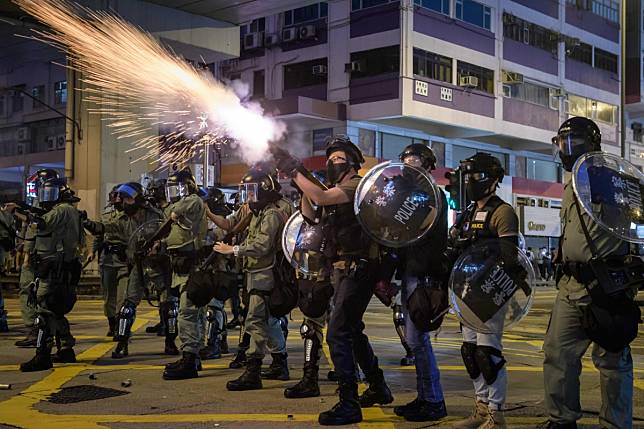 Police fire tear gas during a pro-democracy march on the 20th successive weekend of protests in Hong Kong. Photo: AFP