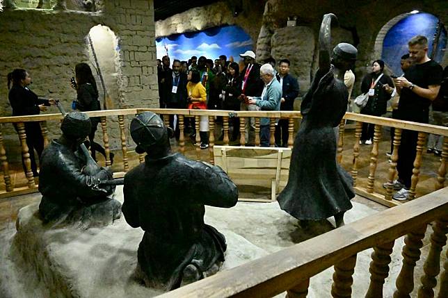 Attendees of the 6th World Media Summit visit an exhibition on traditional musical instruments in Jiayi Village of Xinhe County, northwest China's Xinjiang Uygur Autonomous Region, Oct. 15, 2024. (Xinhua/Wei Hai)