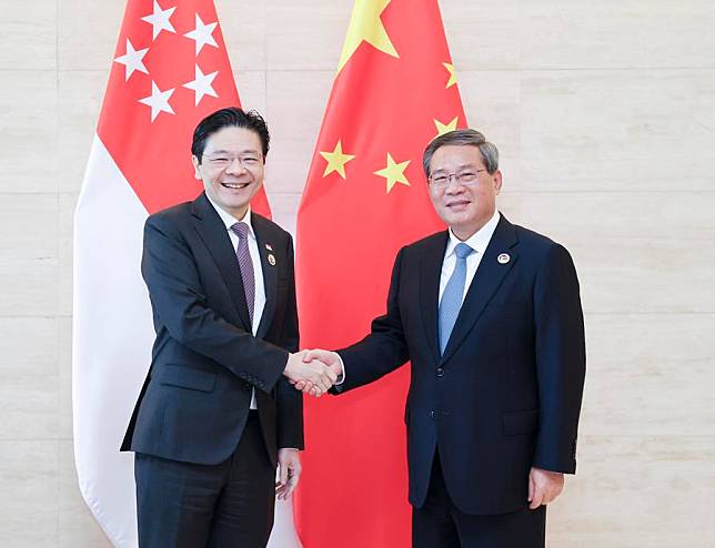 Chinese Premier Li Qiang meets with Singaporean Prime Minister Lawrence Wong on the sidelines of the leaders' meetings on East Asia cooperation held in Vientiane, Laos, Oct. 11, 2024. (Xinhua/Ding Haitao)