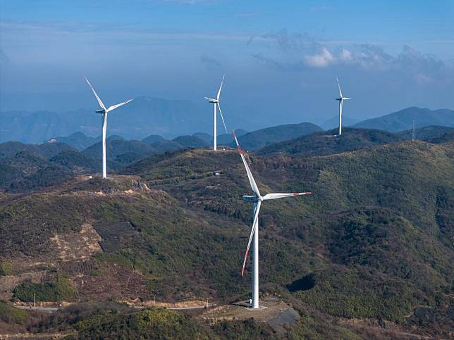 An aerial drone photo taken on Jan. 10, 2024 shows wind turbines in Liutang Township of Shizhu Tujia Autonomous County, southwest China's Chongqing. (Xinhua/Huang Wei)