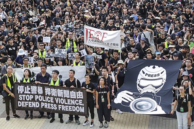 In July, Hong Kong journalists, press photographers, journalism school teachers and commentators took part in a silent march against police violence. Photo: Edmond So