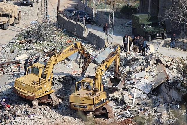 This photo shows members of the Lebanese Civil Defense searching for citizens who were lost under the rubble of their homes in Kfar Shouba, Lebanon, on Jan. 27, 2025. (Photo by Taher Abu Hamdan/Xinhua)