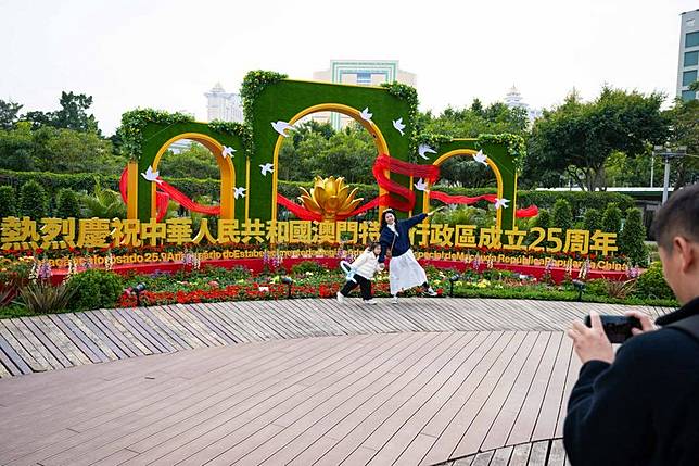 People visit a flower show on Taipa Island in Macao, south China, Dec. 14, 2024. A flower show celebrating the 25th anniversary of Macao's return to the motherland kicked off here on Saturday and will run until Jan. 5, 2025. (Xinhua/Cheong Kam Ka)