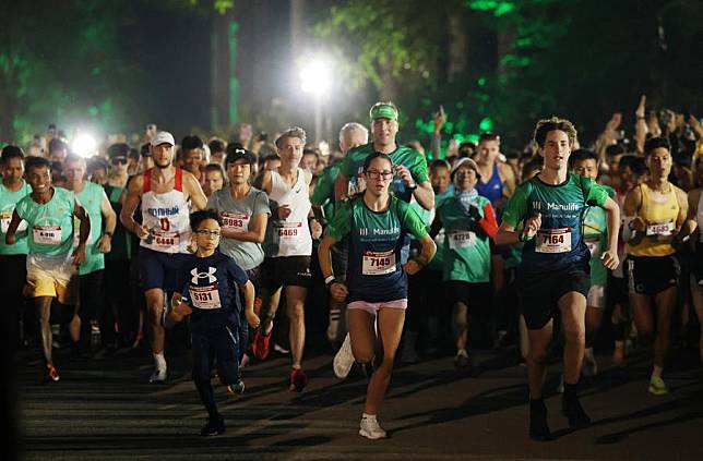 People attend an international half marathon event in Siem Reap province, Cambodia on Dec. 1, 2024. (Photo by Sovannara/Xinhua)