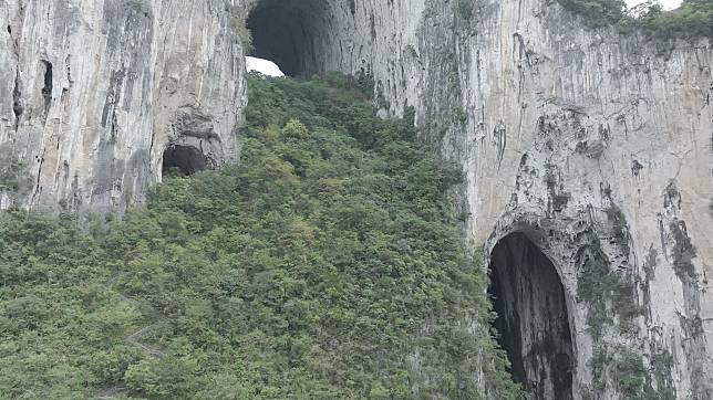 Karst cliffs and cave systems of the Getu River Scenic Area.