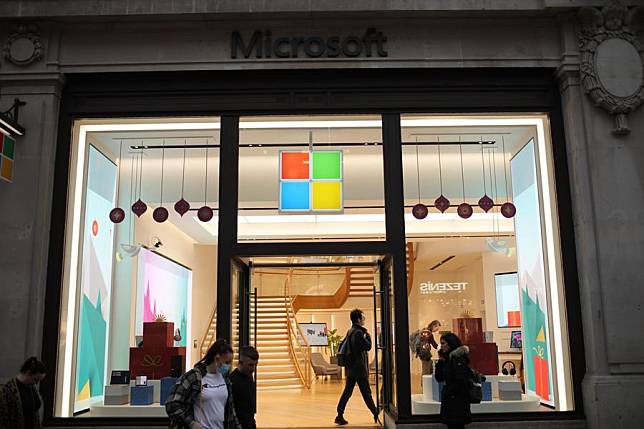 People visit a Microsoft store at Oxford Circus, in London, Britain, Nov. 13, 2021. (Photo by Tim Ireland/Xinhua)