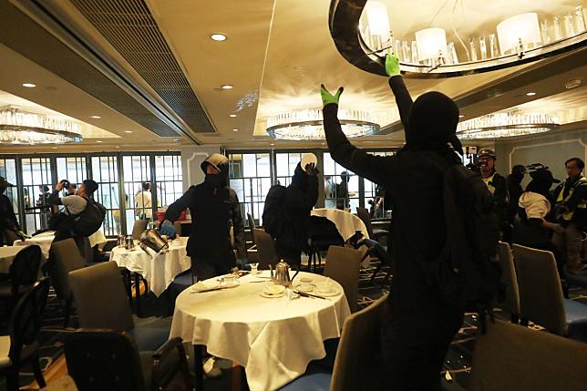 Radical protesters vandalise a restaurant in New Town Plaza. Photo: Sam Tsang