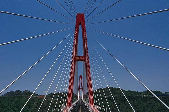 A drone photo taken on April 26, 2024 shows the Longli River bridge in Longli County, southwest China's Guizhou Province. (Xinhua/Yang Wenbin)
