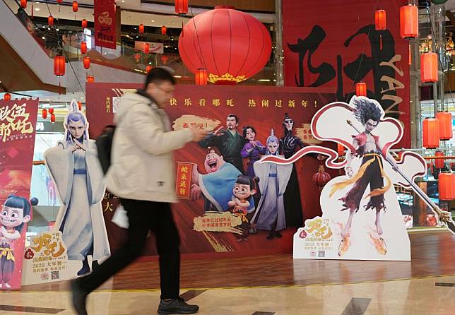 A man walks past posters of the Chinese animated film &ldquo;Ne Zha 2&rdquo; at a shopping mall in Shenyang, northeast China's Liaoning Province, Feb. 18, 2025. (Xinhua/Li Gang)