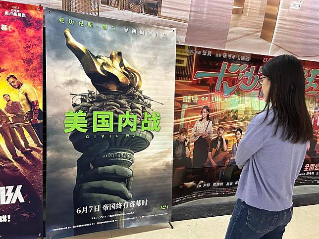 A person views a poster of the U.S. movie &ldquo;Civil War&rdquo; in Beijing, capital of China, May 24, 2024. (Xinhua/Shen Anni)