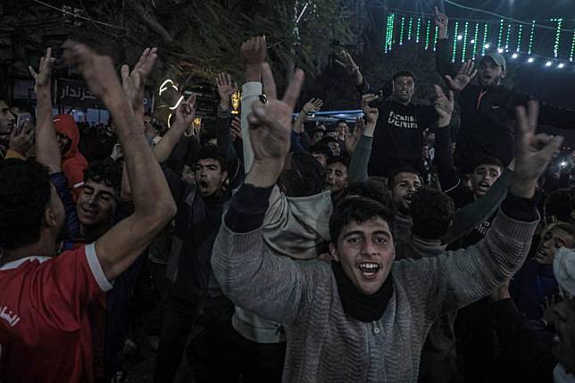 Palestinians react to news on a ceasefire deal with Israel, in Deir al-Balah, central Gaza Strip, Jan. 15, 2025. (Photo by Rizek Abdeljawad/Xinhua)