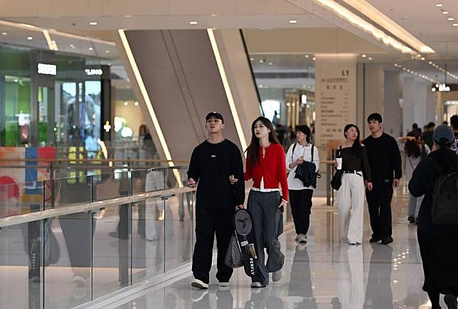 People stroll at a shopping mall in the Golden Street commercial area in north China's Tianjin, Oct. 13, 2024. (Xinhua/Li Ran)