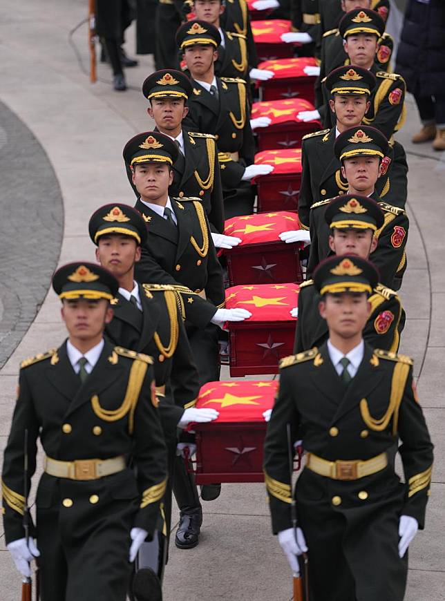 Guards of honor escort the caskets of the fallen Chinese People's Volunteers (CPV) martyrs during a burial ceremony at the CPV martyrs' cemetery in Shenyang, northeast China's Liaoning Province, Nov. 29, 2024. The remains of 43 CPV soldiers who lost their lives during the War to Resist U.S. Aggression and Aid Korea (1950-1953) were laid to rest on Friday in Shenyang. (Xinhua/Li Gang)