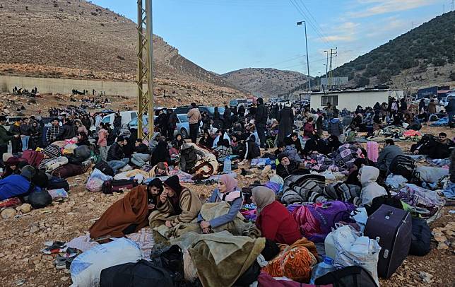 Syrians fleeing Syria are stuck at the border with Lebanon in the Masnaa border crossing area on Dec. 12, 2024. (Photo by Maher Kamar/Xinhua)