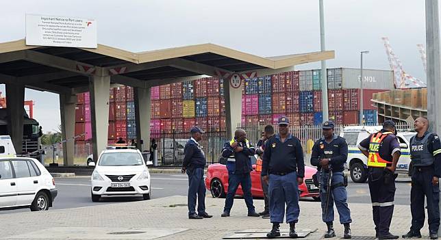 Police are seen outside the Transnet port in Cape Town, South Africa, on Oct. 13, 2022. (Photo by Xabiso Mkhabela/Xinhua)