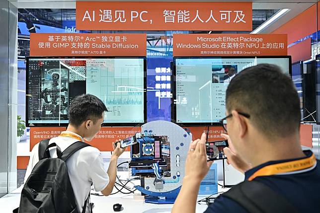 Visitors take pictures at the booth of Intel during the 2023 China International Fair for Trade in Services (CIFTIS) at China National Convention Center in Beijing, capital of China, Sept. 4, 2023. (Xinhua/Li Xin)