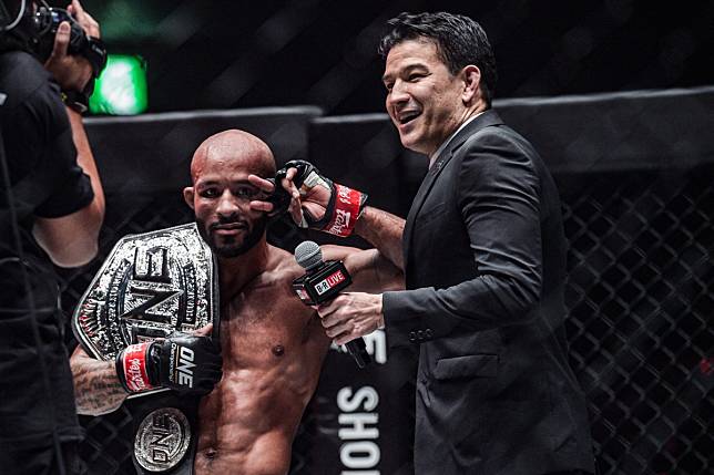 Demetrious Johnson with Mitch Chilson after his win against Danny Kingad in Tokyo. Photo: One Championship