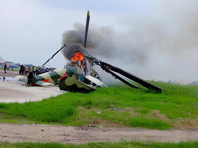 A helicopter of the Armed Forces of the Democratic Republic of the Congo (DRC) crashes on the runway of Ndolo Airport, a secondary airport in DRC's capital Kinshasa, Oct. 30, 2024. (Agence Congolaise de Presse/Handout via Xinhua)