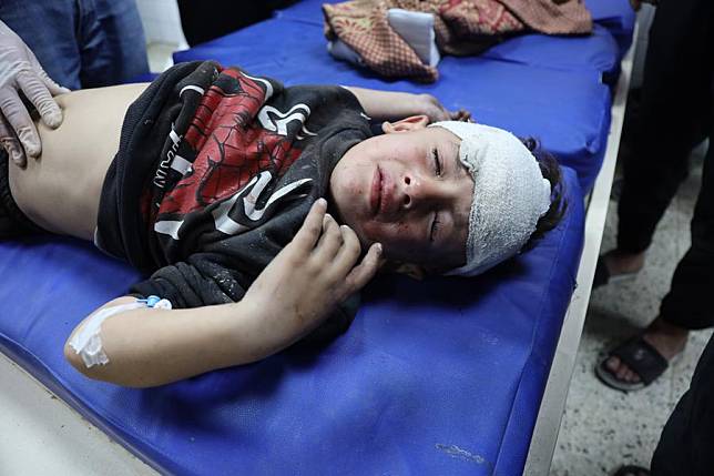 An injured child is seen at Al-Ahli Arab Hospital after an Israeli airstrike in Gaza City, on Dec. 19, 2024. (Photo by Abdul Rahman Salama/Xinhua)