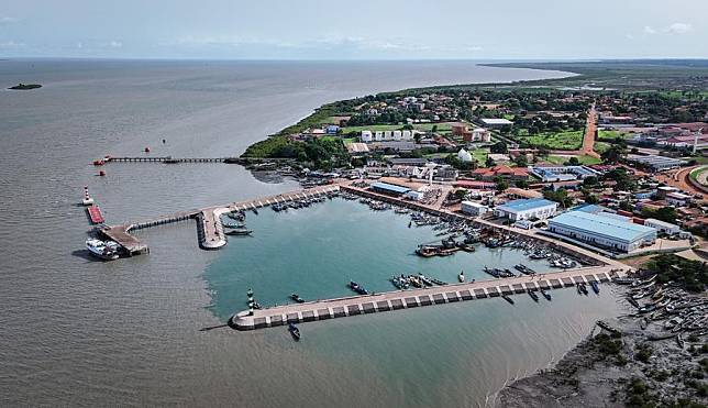 An aerial drone photo taken on July 10, 2024 shows a view of Bandim Fishing Port and Chinese-built aquatic products processing and storage complex in Bissau, Guinea-Bissau. (Xinhua/Han Xu)