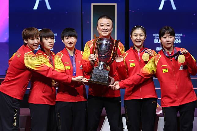 Gold medalists team China pose with the trophy during the awarding ceremony for the women's team at the ITTF World Team Table Tennis Championships Finals Busan 2024 in Busan, South Korea, Feb. 24, 2024. (Xinhua/Yao Qilin)