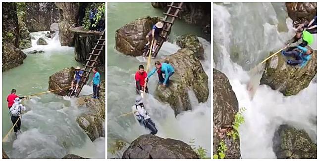 浙江台州石人峽景區有一男一女遊客用繩索橫渡峽谷溪流時，被水沖走(影片截圖)
