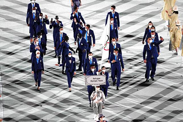 The Refugee Olympic Team parades into the Olympic Stadium during the opening ceremony of the Tokyo 2020 Olympic Games on July 23, 2021. (Xinhua/Xu Chang)