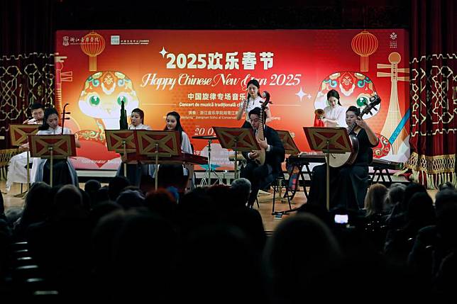 Musicians play a tune at the &ldquo;2025 Happy Spring Festival&rdquo; Chinese traditional music concert at the Romanian Athenaeum in Bucharest, capital of Romania, Jan. 20, 2025. (Photo by Cristian Cristel/Xinhua)