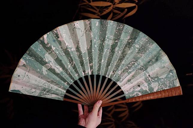 A lacquer coated fan made by Hao Guanxiong is displayed at his studio in Changsha, central China's Hunan Province, Feb. 28. 2024.