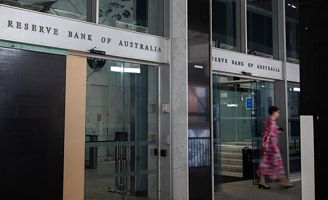 A woman walks out of the Reserve Bank of Australia in Sydney, Australia, Nov. 7, 2023. (Photo by Hu Jingchen/Xinhua)