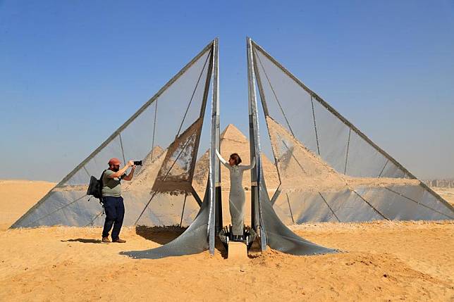 An artistic installation is displayed during the &ldquo;Forever Is Now&rdquo; international art exhibition at Giza Pyramids scenic spot in Giza, Egypt, Oct. 24, 2024. The fourth edition of &ldquo;Forever Is Now&rdquo; international art exhibition on Thursday kicked off in the area of Egypt's Giza Pyramids scenic spot, showcasing 12 artworks of artists from different countries. The exhibition runs from Oct. 24 to Nov. 16. (Xinhua/Sui Xiankai)