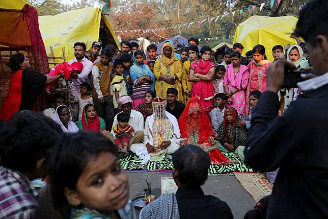 旅居印度的難民家庭舉行傳統婚禮。（示意圖非當事人，湯森路透）
