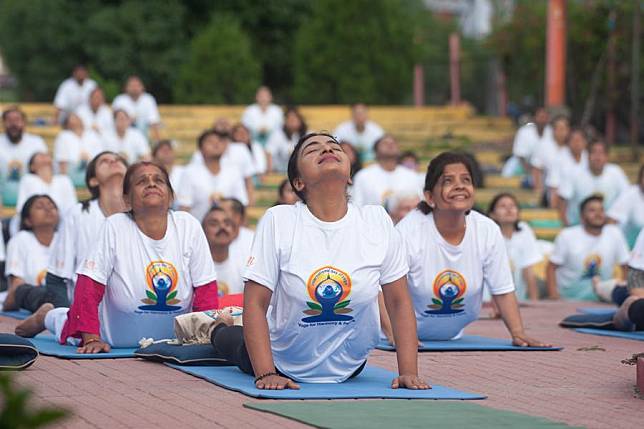 Participants take part in a yoga session to celebrate International Day of Yoga in Kathmandu, Nepal, June 21, 2024. (Photo by Hari Maharjan/Xinhua)