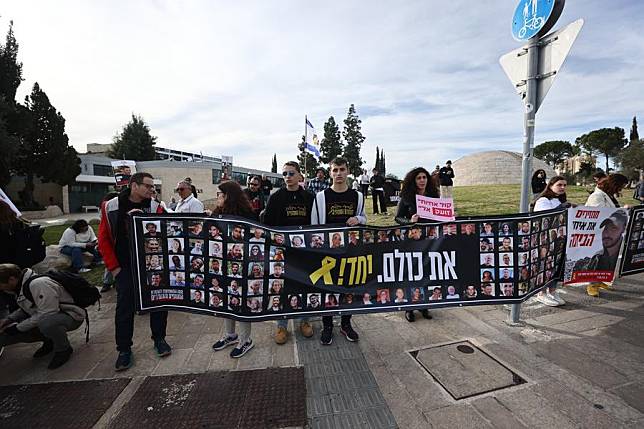 Relatives and supporters of hostages held in the Gaza Strip rally outside the Israeli Prime Minister's office in Jerusalem, on Jan. 14, 2025. (Photo by Jamal Awad/Xinhua)