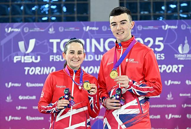 Gold medalists Robyn Munro (L) and Orrin Carson pose for a photo during the award ceremony of the curling mixed doubles final at the Torino 2025 FISU World University Winter Games in Turin, Italy, on Jan. 14, 2025. (Xinhua/He Canling)