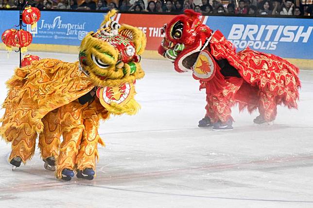 Lion dancers perform on ice to celebrate the upcoming Chinese New Year, or the Spring Festival, at Bintaro Exchange Mall in South Tangerang, Banten Province, Indonesia, Jan. 25, 2025. (Xinhua/Agung Kuncahya B.)