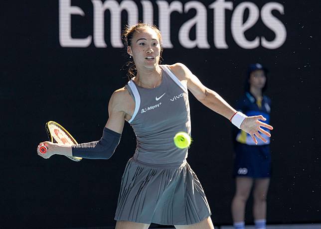 Zheng Qinwen of China hits a return during an exhibition match against Elina Svitolina of Ukraine at Australian Open tennis tournament in Melbourne, Australia, Jan. 8, 2025. (Photo by Chu Chen/Xinhua)