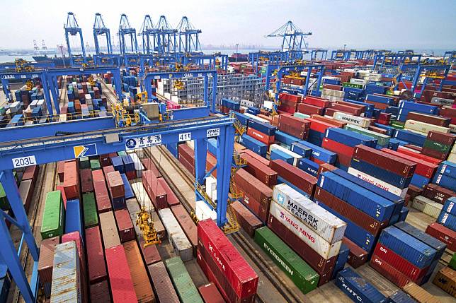 Containers are piled up at a port in Qingdao in east China's Shandong province. Photo: Associated Press
