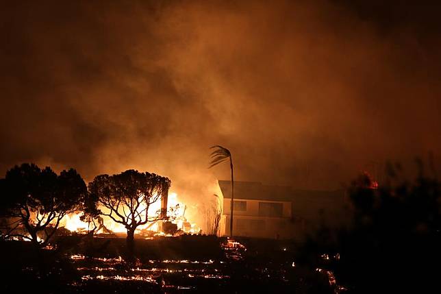 A house is engulfed by flames on the site of the Palisades fire in Pacific Palisades, Los Angeles County, California, the United States, on Jan. 7, 2025. (Photo by Qiu Chen/Xinhua)