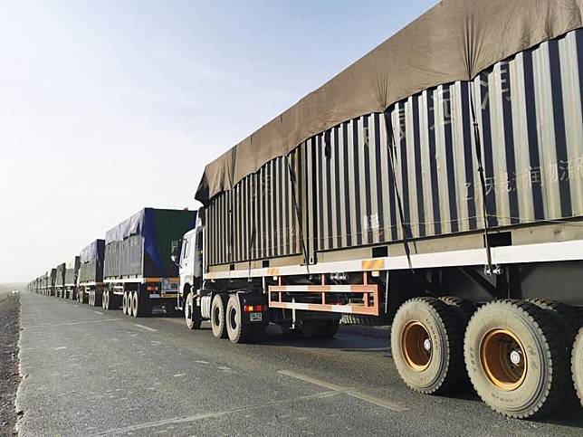 Container trucks loaded with coal wait to leave the Gashuun Sukhait border port in Mongolia, March 23, 2020. (Xinhua)