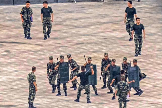 Members of the People's Armed Police Force stage an anti-riot drill in Shenzhen. Photo: EPA-EFE
