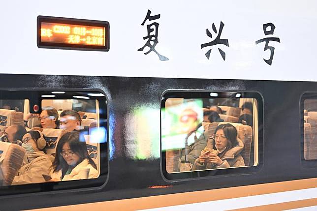 Passengers wait on a bullet train bound for Beijing at Tianjin Railway Station in north China's Tianjin, Dec. 10, 2024. (Xinhua/Li Ran)