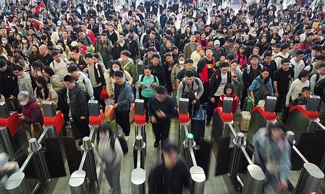 A drone photo taken on May 5, 2024 shows passengers going through ticket barriers at Hengyang East Station in Hengyang, central China's Hunan Province. (Photo by Cao Zhengping/Xinhua)
