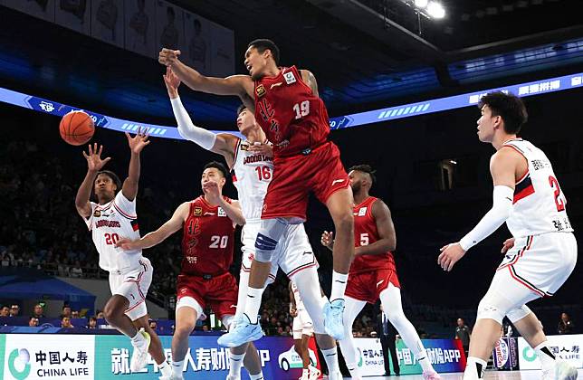 Taruike Jianiyou (top) of Beijing Ducks vies for the ball during a match between Beijing Ducks and Guangzhou Loong Lions at the 2024-2025 season of the Chinese Basketball Association (CBA) league in Beijing, China, Oct. 20, 2024. (Xinhua/Zhang Chen)