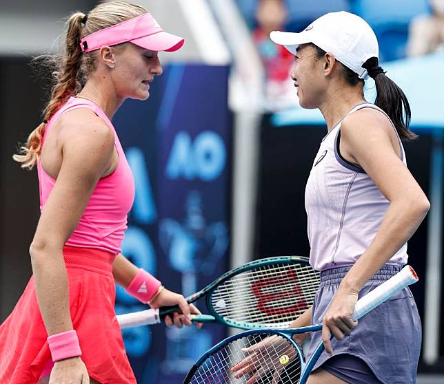 Zhang Shuai &reg;/Kristina Mladenovic react during the women's doubles quarterfinal match against Taylor Townsend and Katerina Siniakova at Australian Open tennis tournament in Melbourne, Australia, Jan. 22, 2025. (Xinhua/Ma Ping)